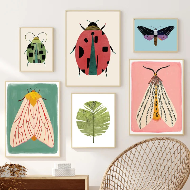 Set of colorful insect and leaf prints on a wall with a wicker chair in the foreground.