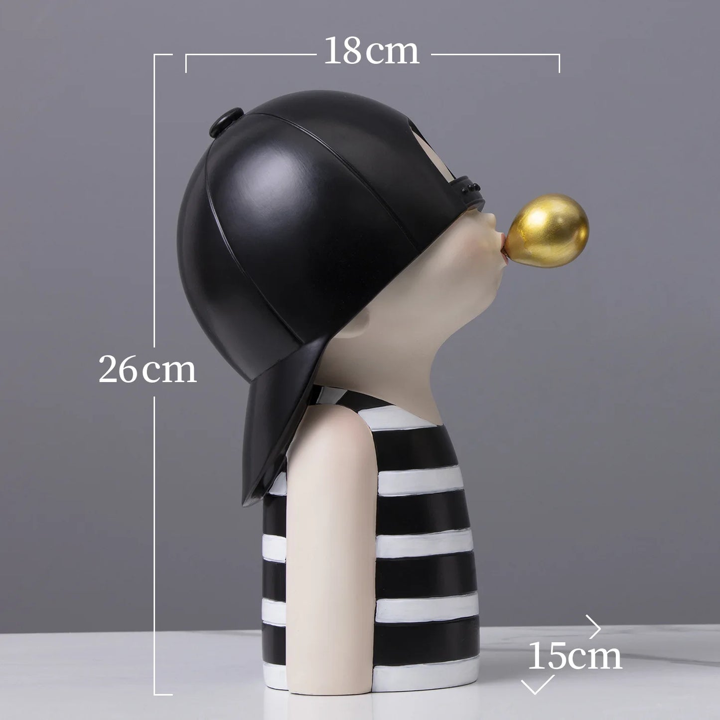 Decorative figure with black helmet and striped outfit, holding a gold object, on a gray background with measurements.