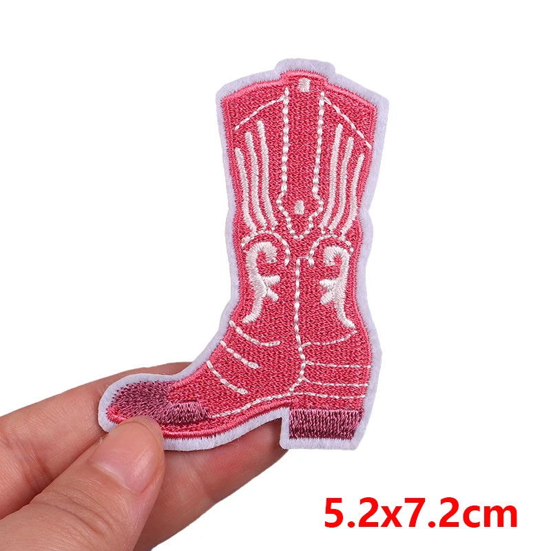 Red cowboy boot patch held by a hand with dimensions displayed.