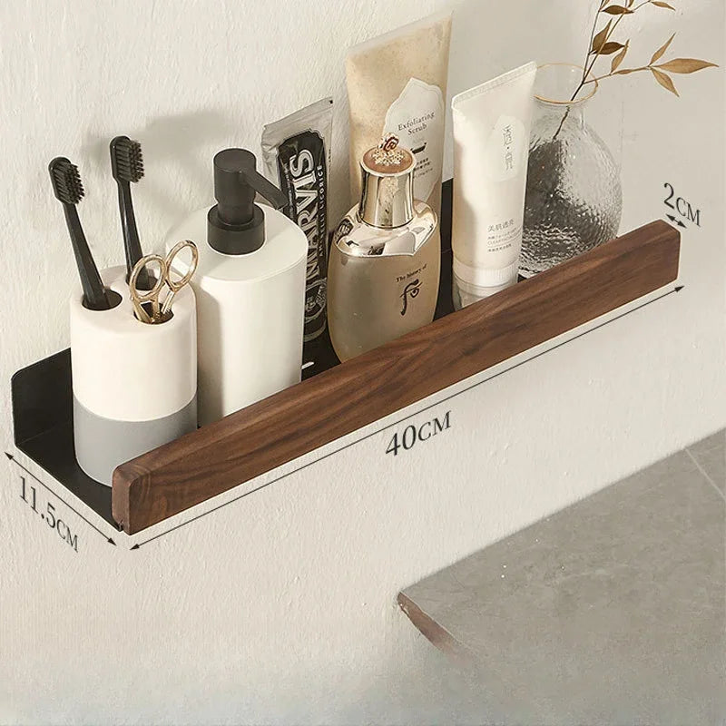 Wooden shelf with bathroom products on a white wall