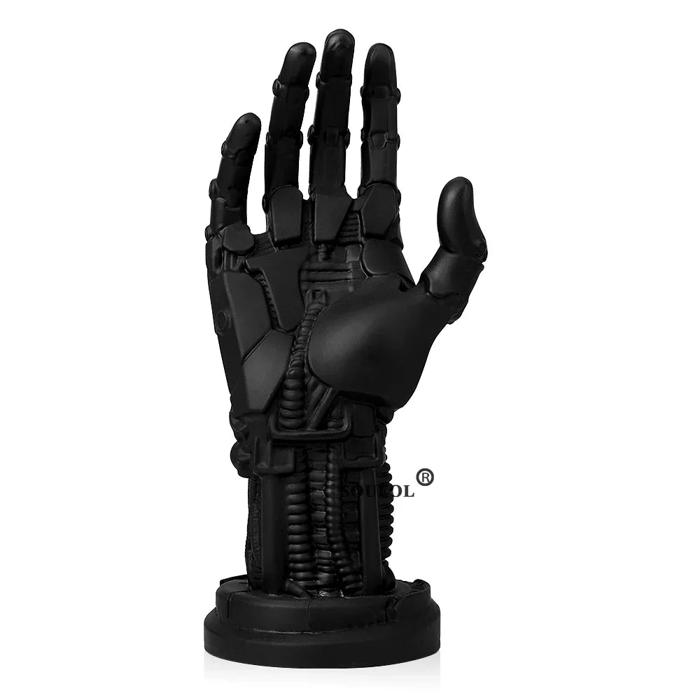 Black mechanical hand sculpture on a white background