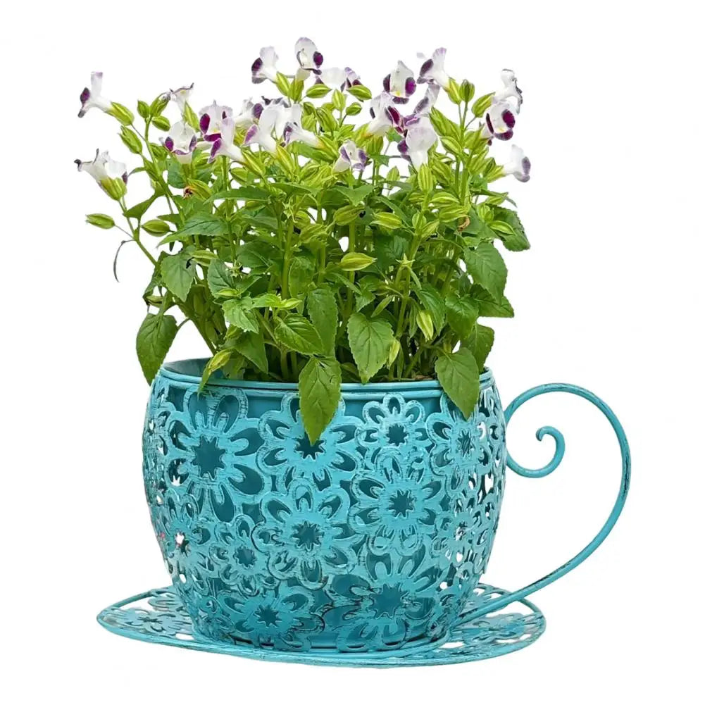 Turquoise metal plant holder with a potted plant on a white background