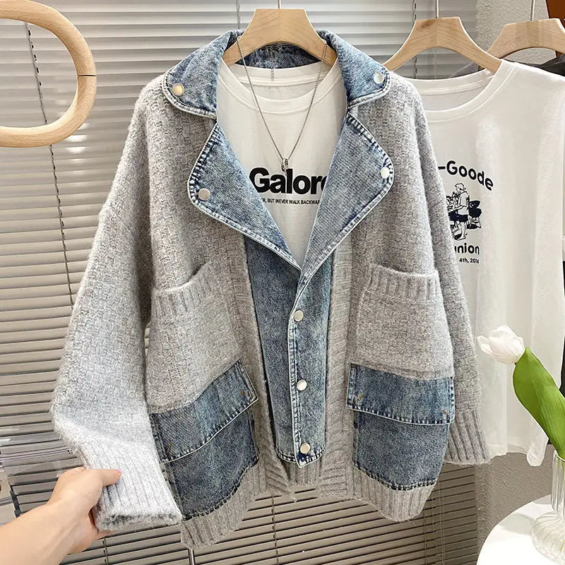 Denim and gray jacket on a hanger with a blurred background
