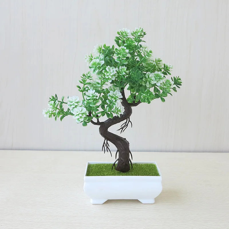 Artificial bonsai tree in a white pot on a light background