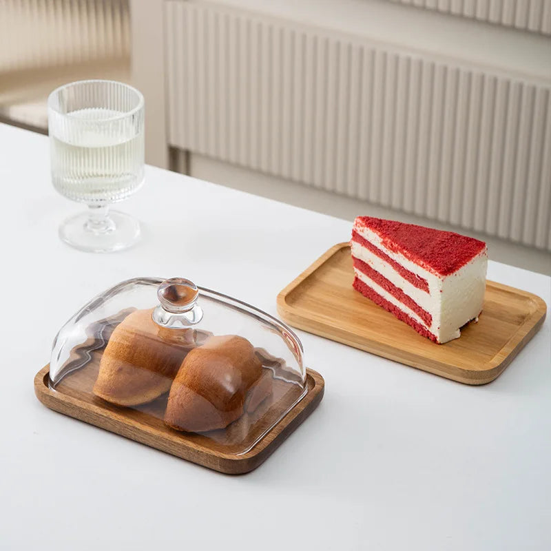Glass pastry display dome with bamboo serving base