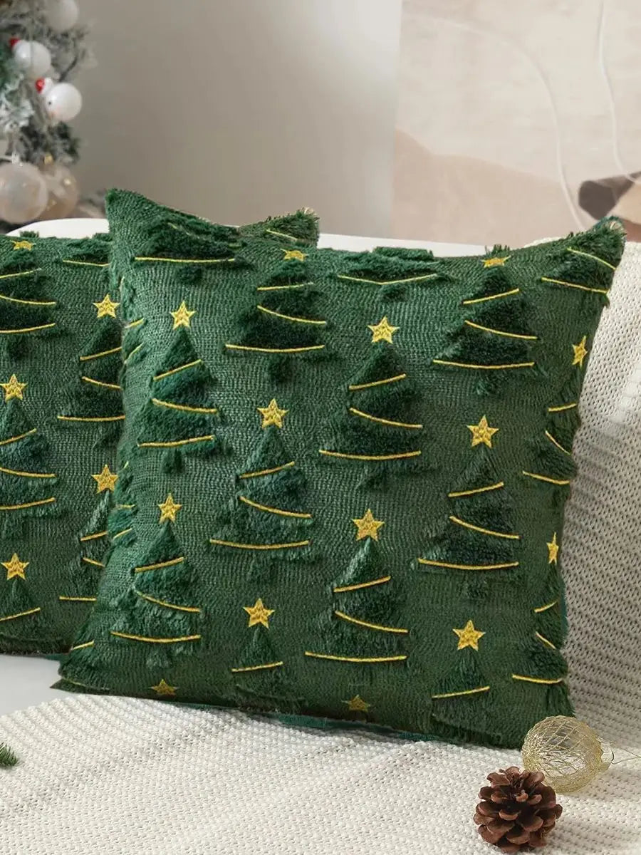 Green pillows with Christmas tree patterns on a neutral background
