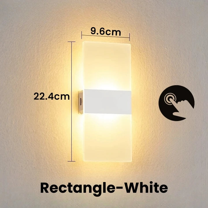 Wall-mounted rectangular light fixture with dimensions labeled on a plain wall.
