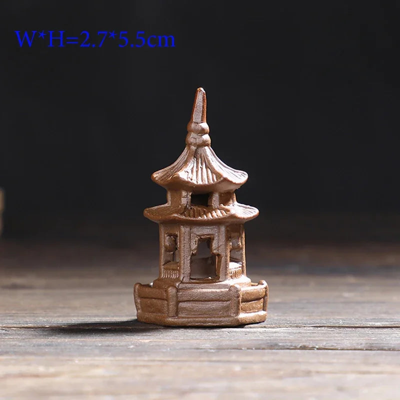 Small pagoda model on a wooden surface with a dark background