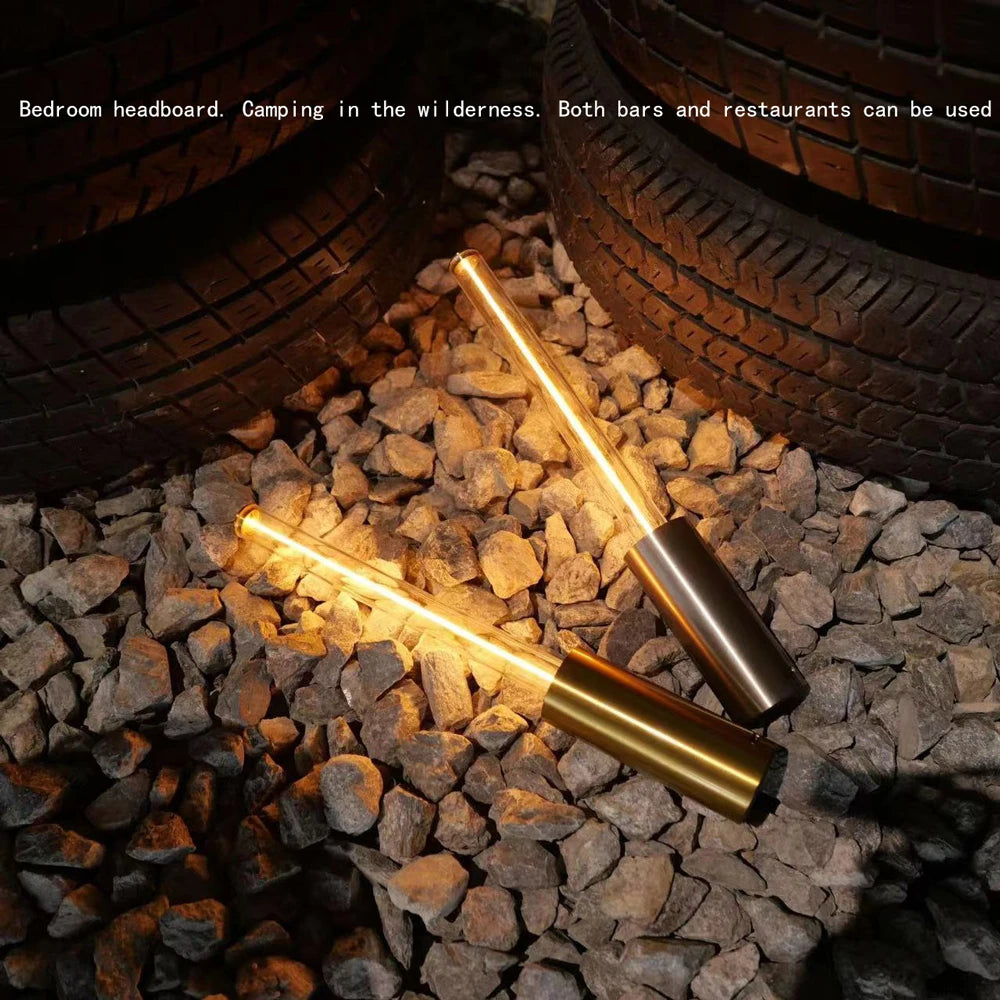 Two metallic bars on stones with tires in the background