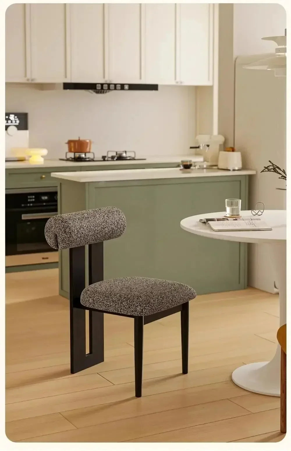 Modern kitchen with a gray chair on a wooden floor