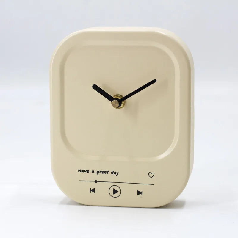 Beige clock with black hands and text on a white background