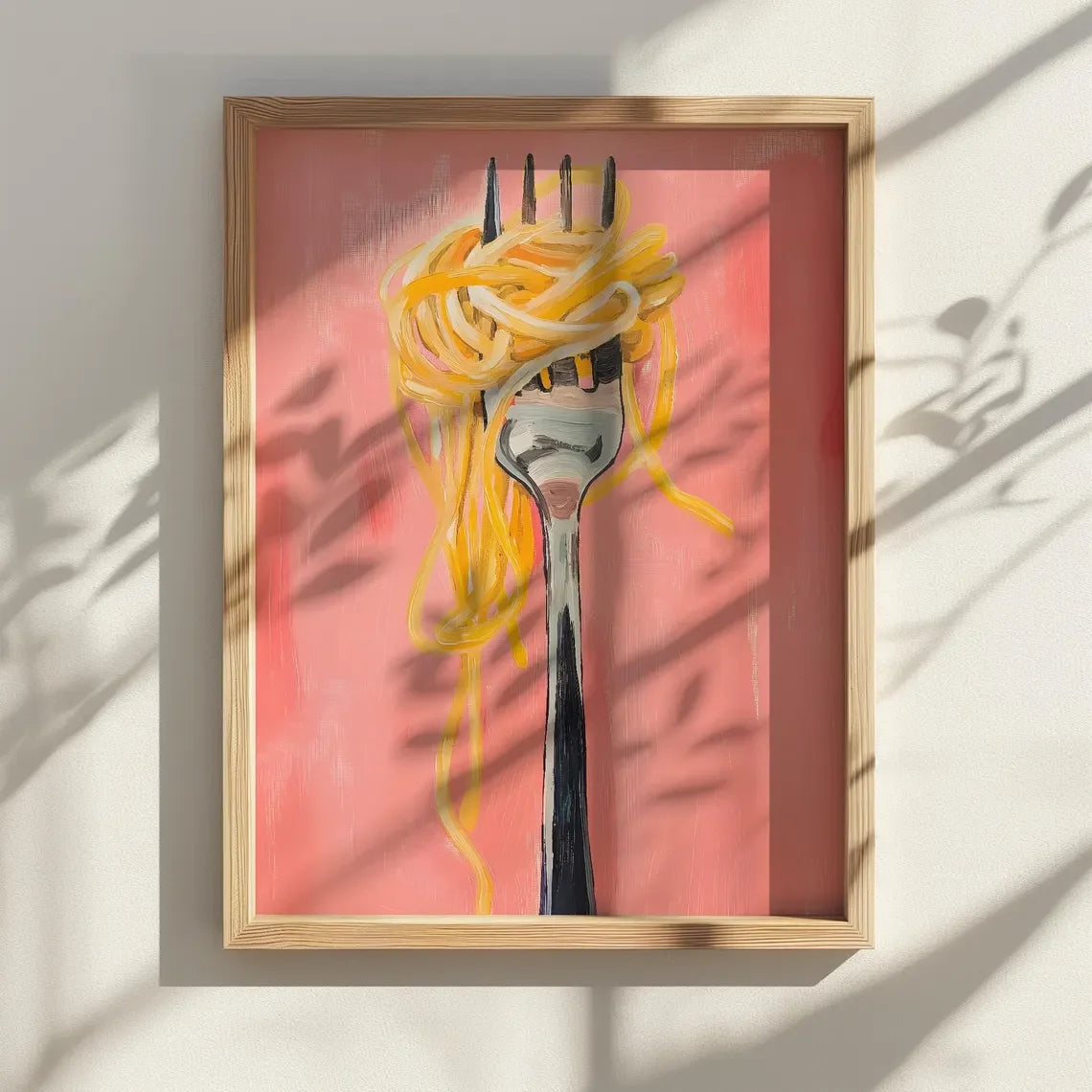 Framed artwork of a fork with spaghetti on a pink background