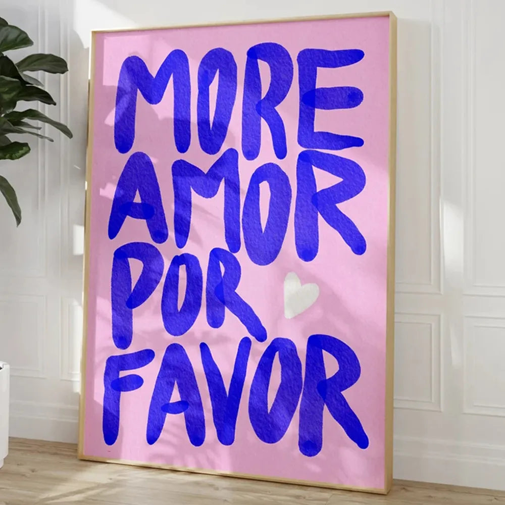 Framed artwork with 'More Amor Por Favor' text on a pink background