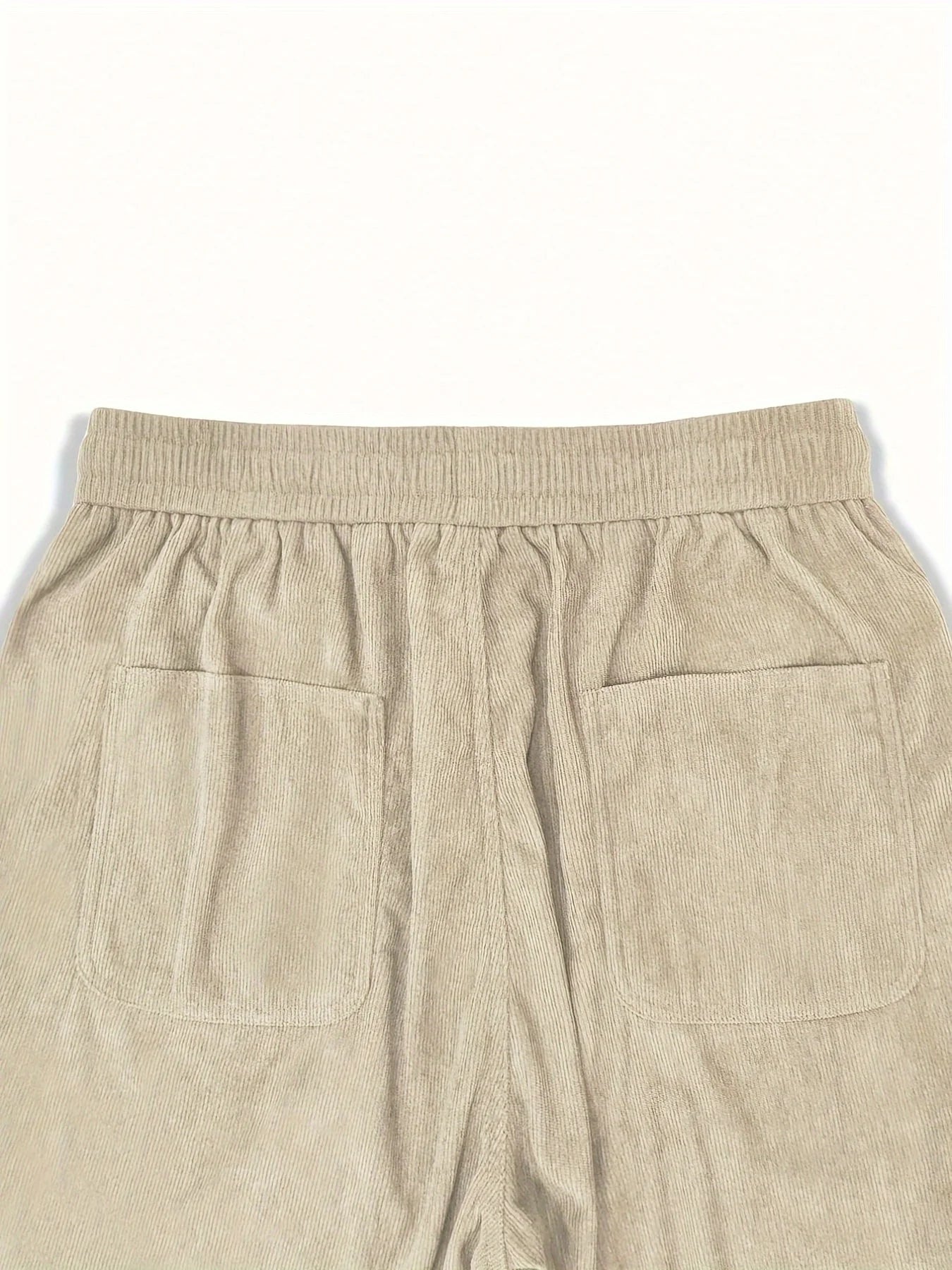 Beige pants with a plain background