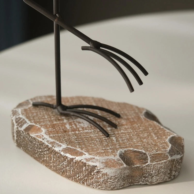Decorative metal sculpture on a stone base