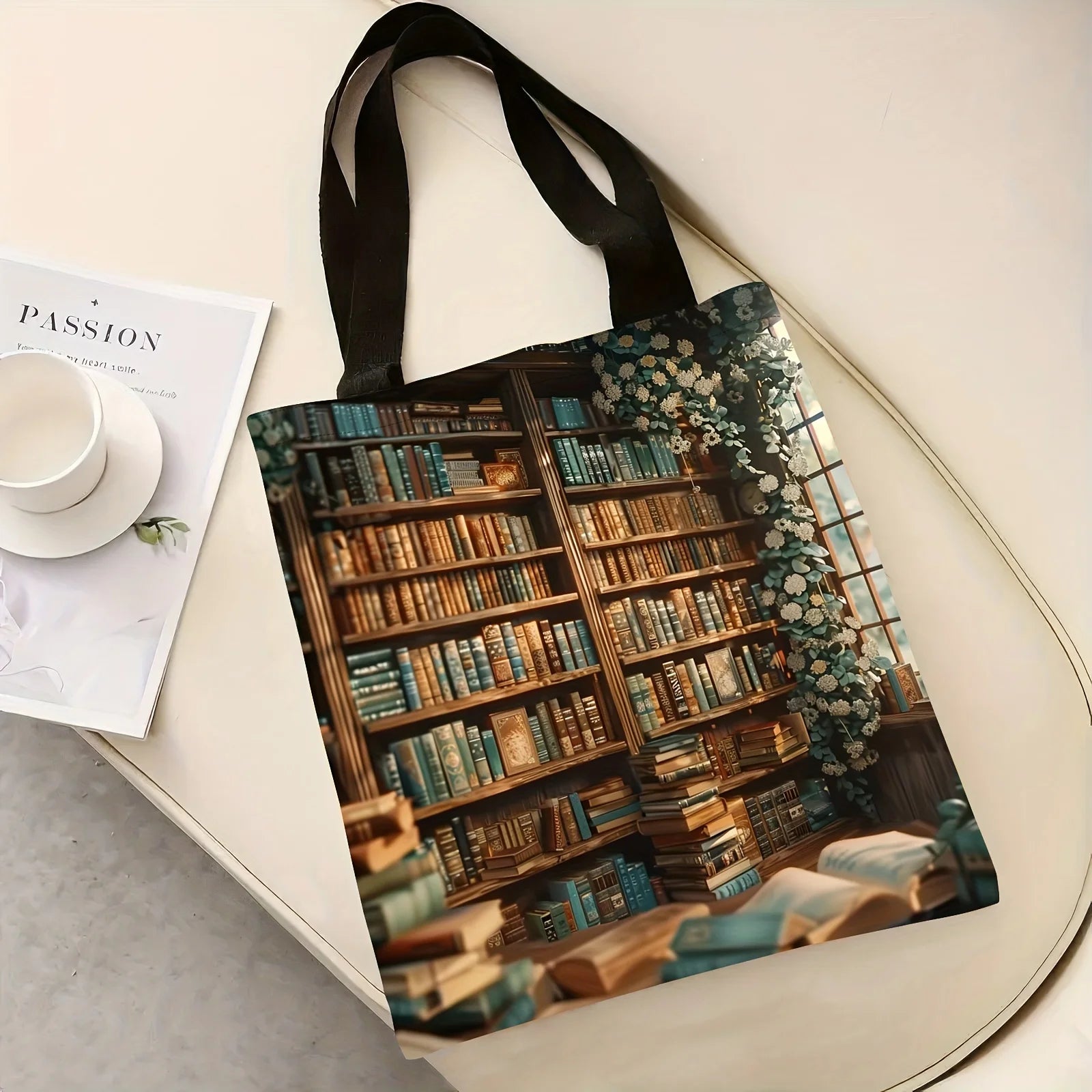 Tote bag with a design of a library on a white surface with a cup and saucer.