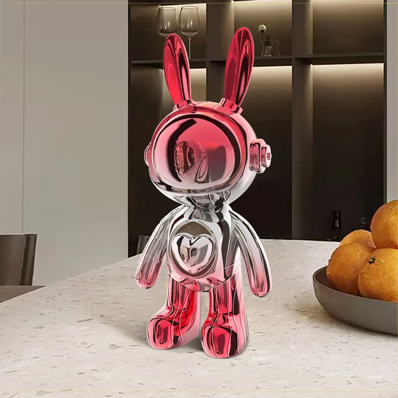 Pink rabbit-shaped object on a table with a neutral background