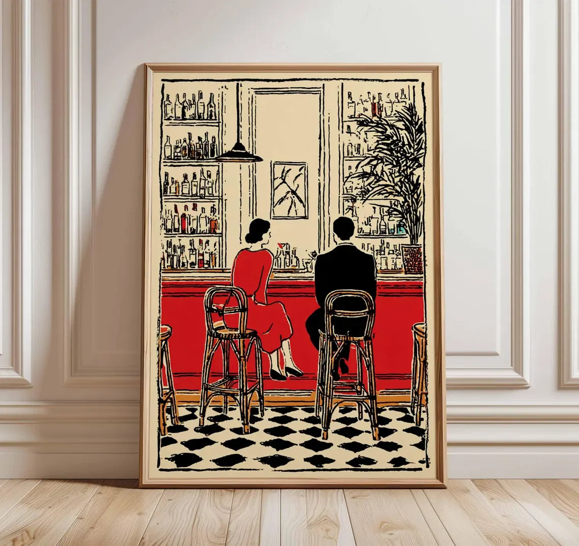 Illustrated canvas print showing a couple seated at a red cocktail bar with black-and-white tiled flooring, displayed in a light wooden frame.