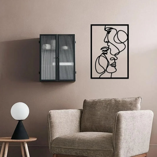 Modern interior with a gray armchair, side table, and metal abstract wall art.
