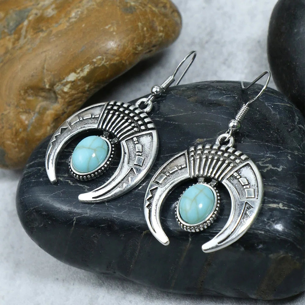 Silver earrings with turquoise stones on black stones