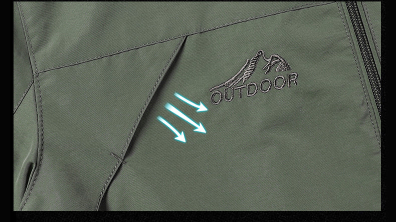 Green jacket with 'Outdoor' logo and arrows on a black background