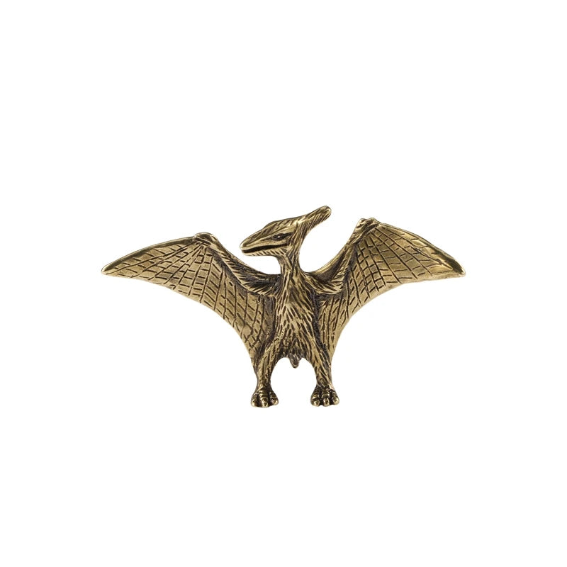 Bronze pterodactyl figurine on a white background