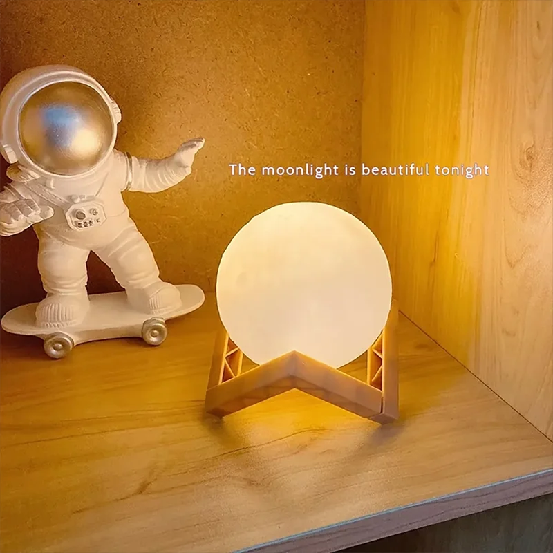 Small astronaut figurine on a skateboard next to a moon-shaped lamp on a wooden surface with a warm glow.