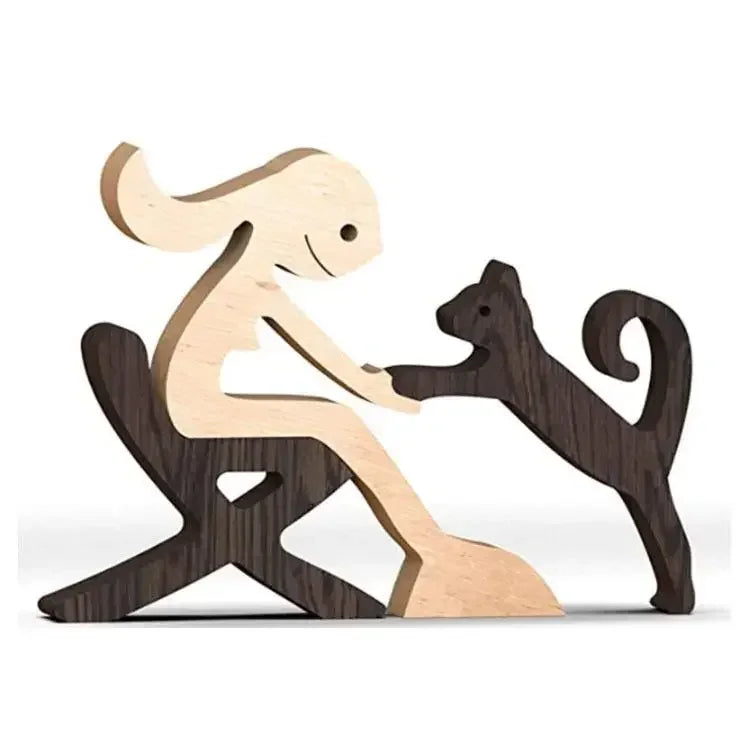 Wooden sculpture of a dog and cat interacting on a white background