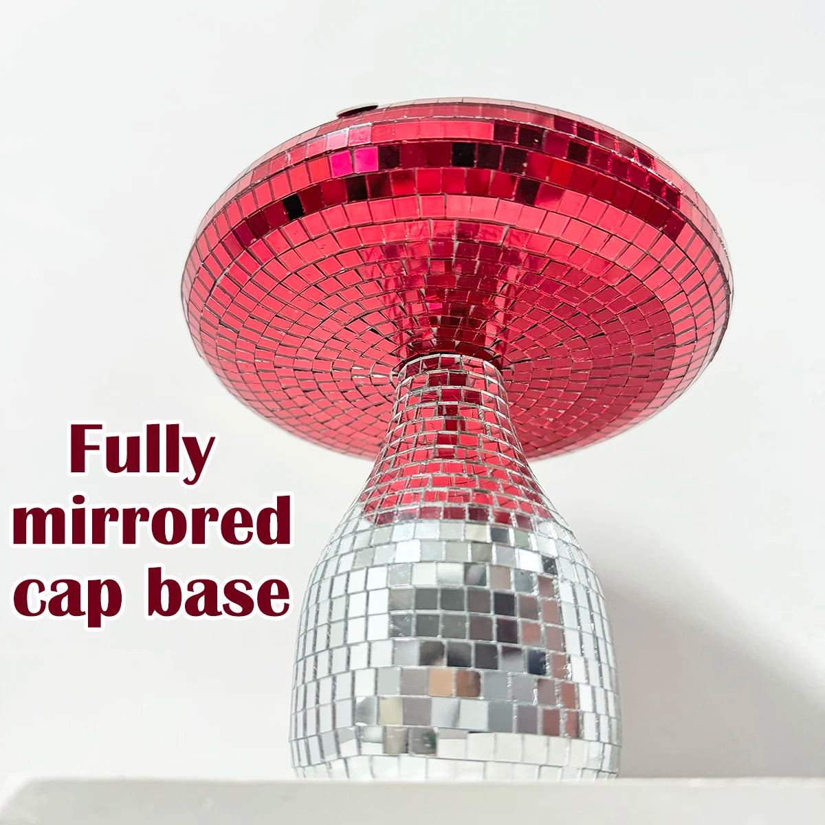Mushroom ornament with fully mirrored cap base on a white background