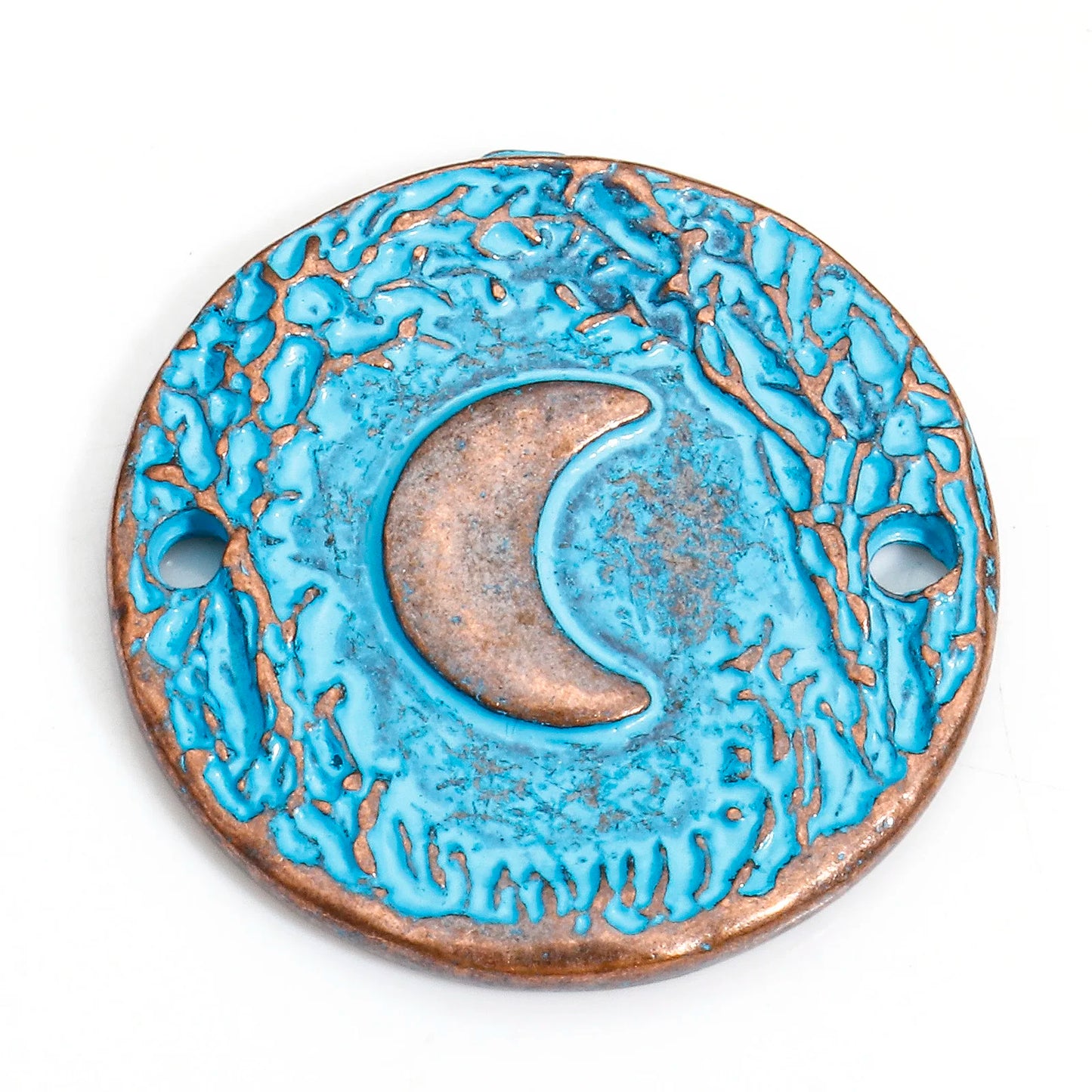 Decorative circular object with blue and bronze design on a white background