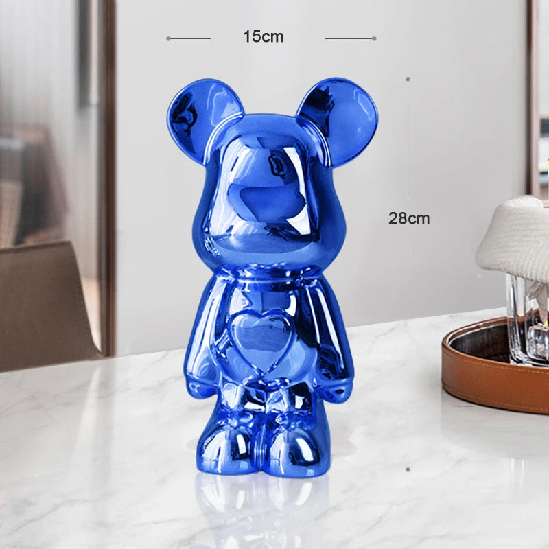 Blue bear-shaped object with measurements on a white surface