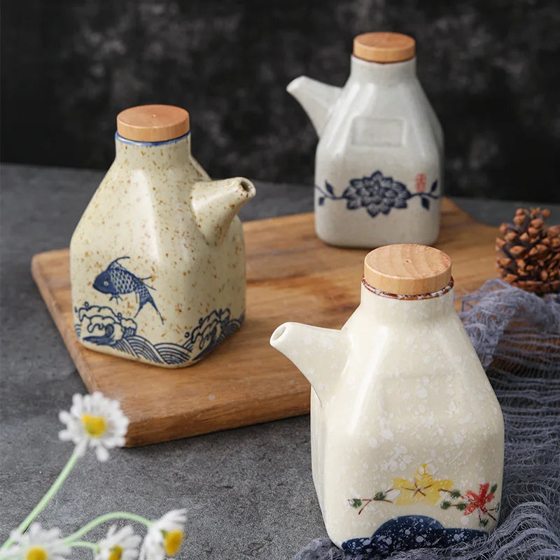 Three ceramic sauce dispensers with wooden lids on a wooden board with a dark background