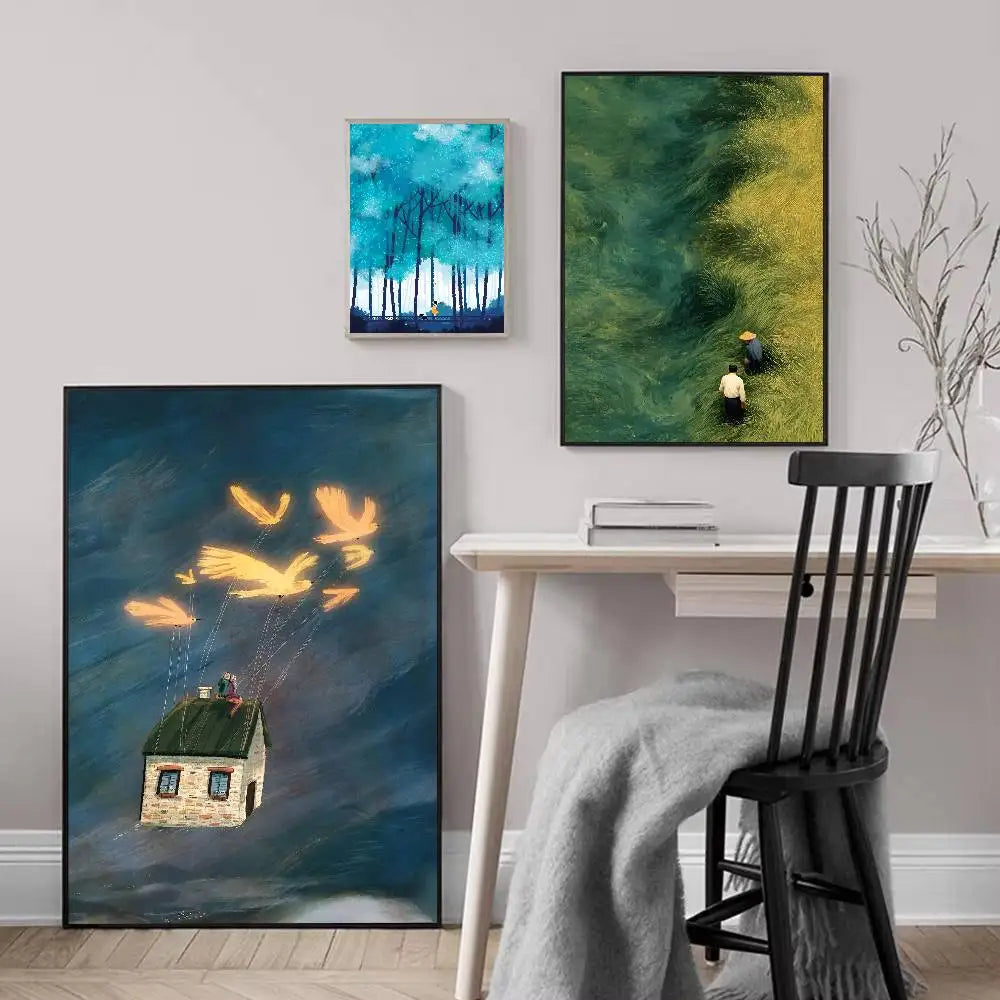 Three abstract paintings on a wall above a desk with a chair.