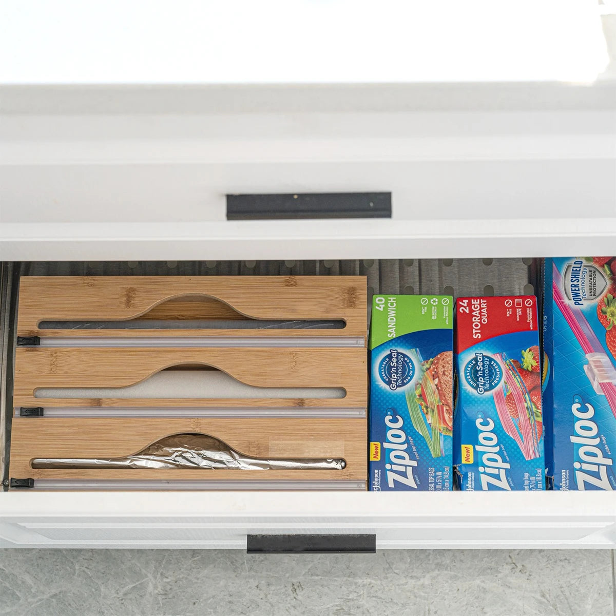 Bamboo kitchen wrap dispenser with integrated foil and cling film cutter