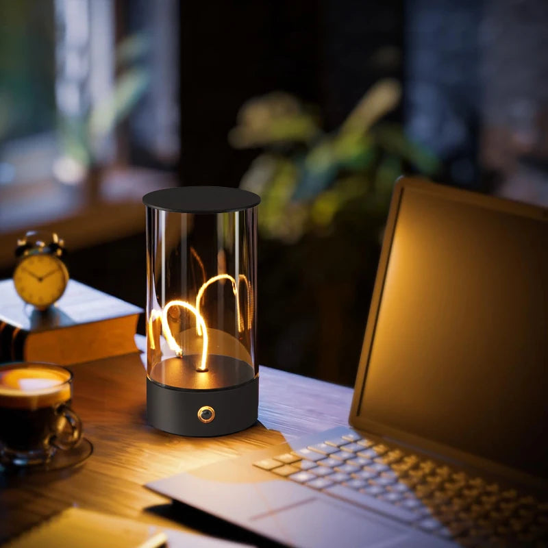 Lamp with 'mom' text on a desk with laptop and coffee