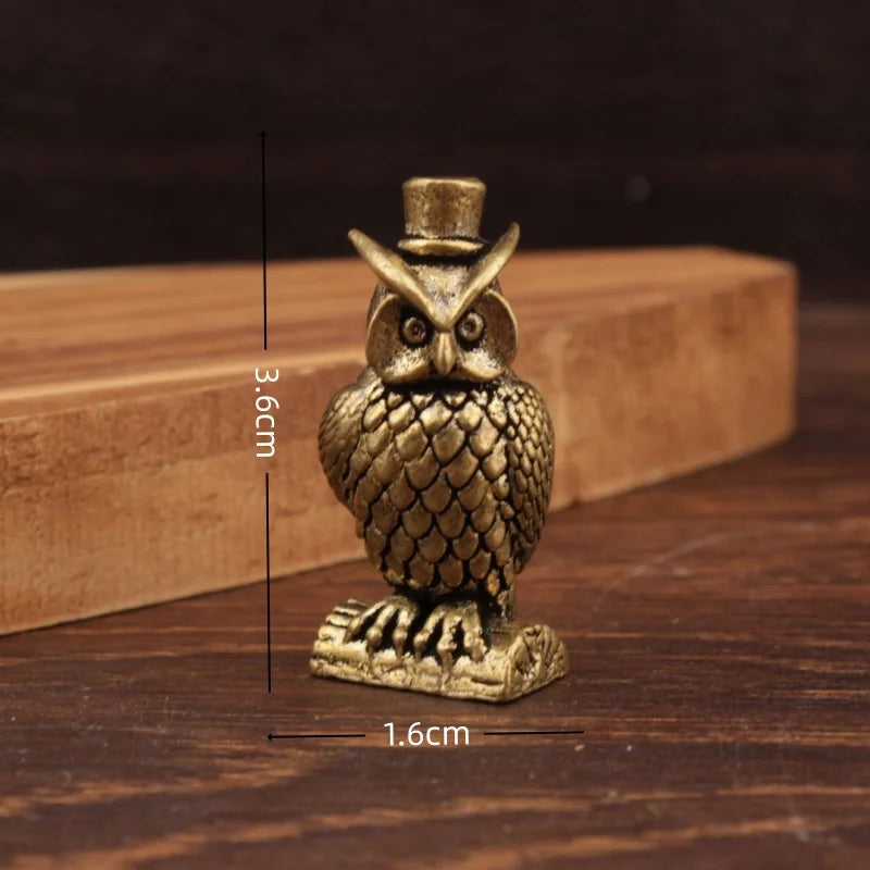 Small brass animal ornament figurine with detailed finish placed on a desk as decorative accent