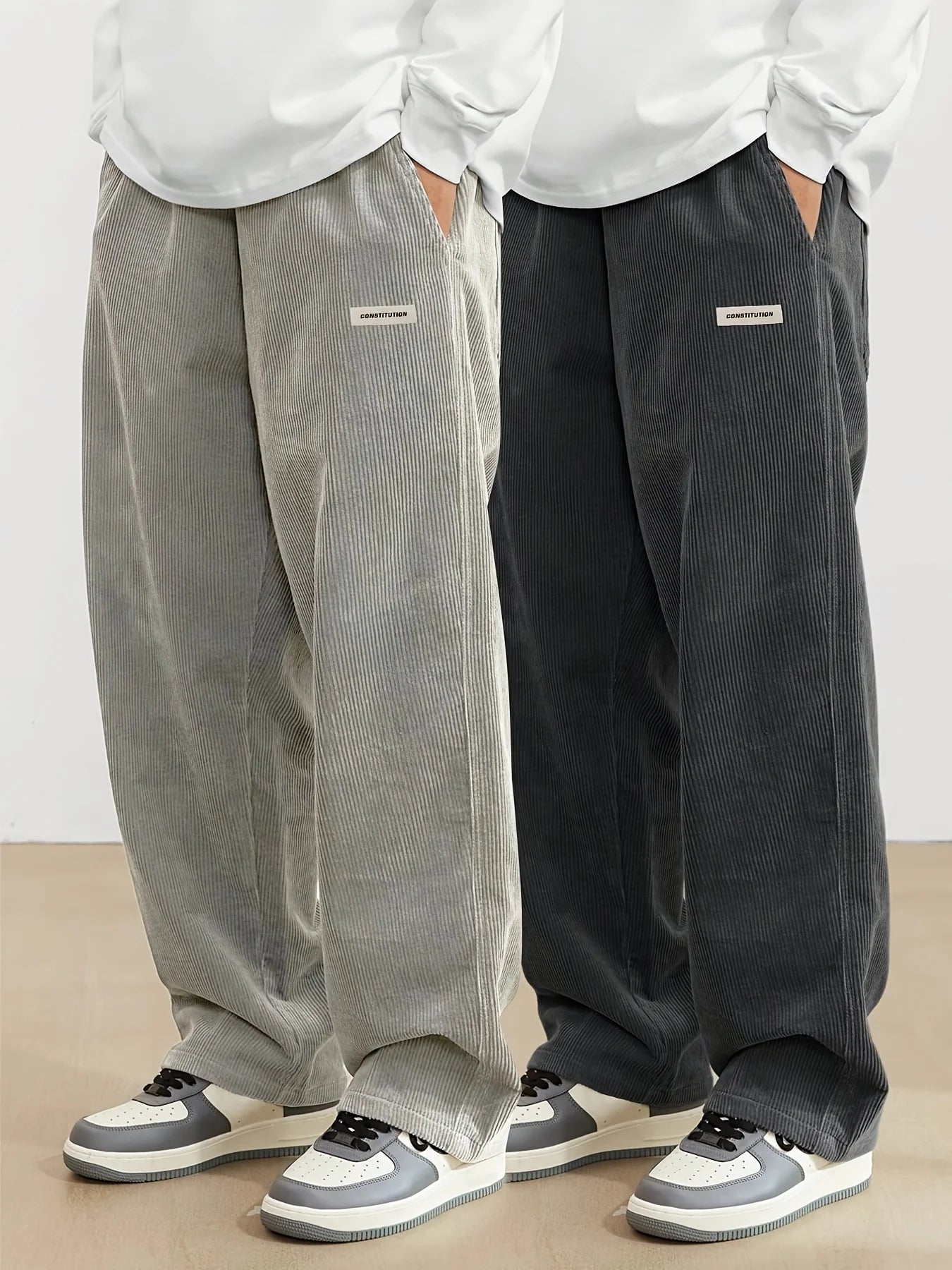 Two pairs of wide-leg pants, one gray and one black, worn by models on a plain background.