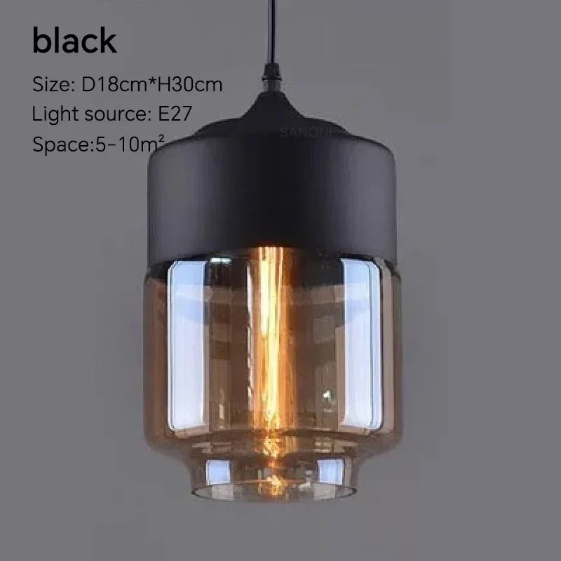 Black pendant light with glass shade on a gray background