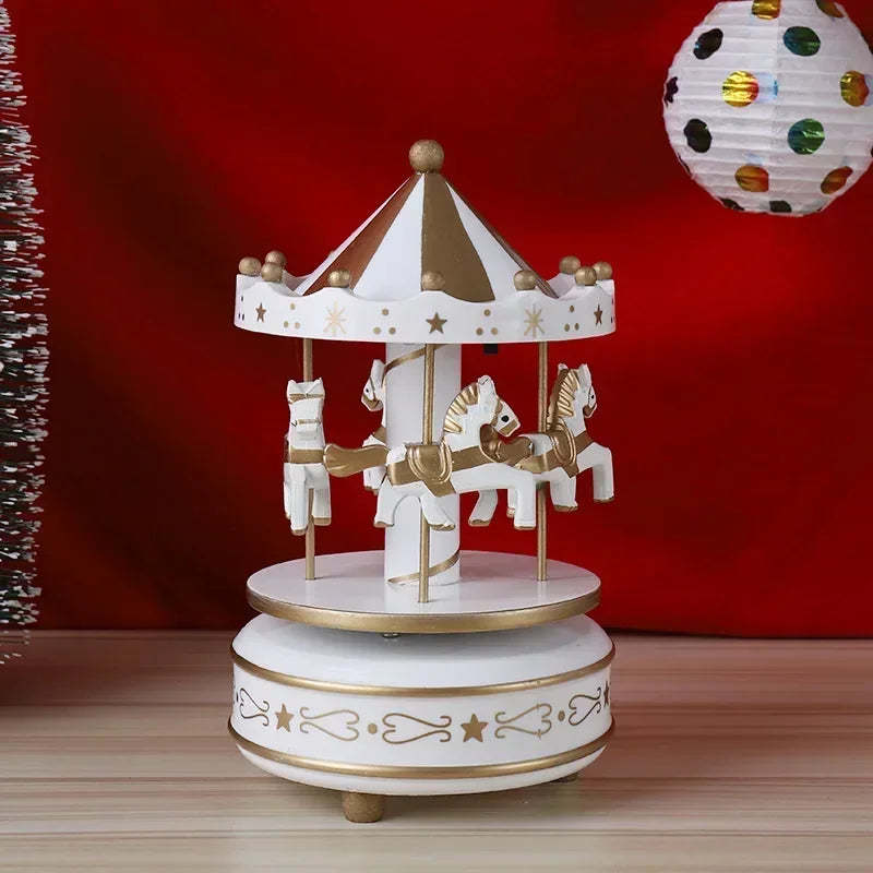 Decorative carousel with horses on a wooden surface against a red background