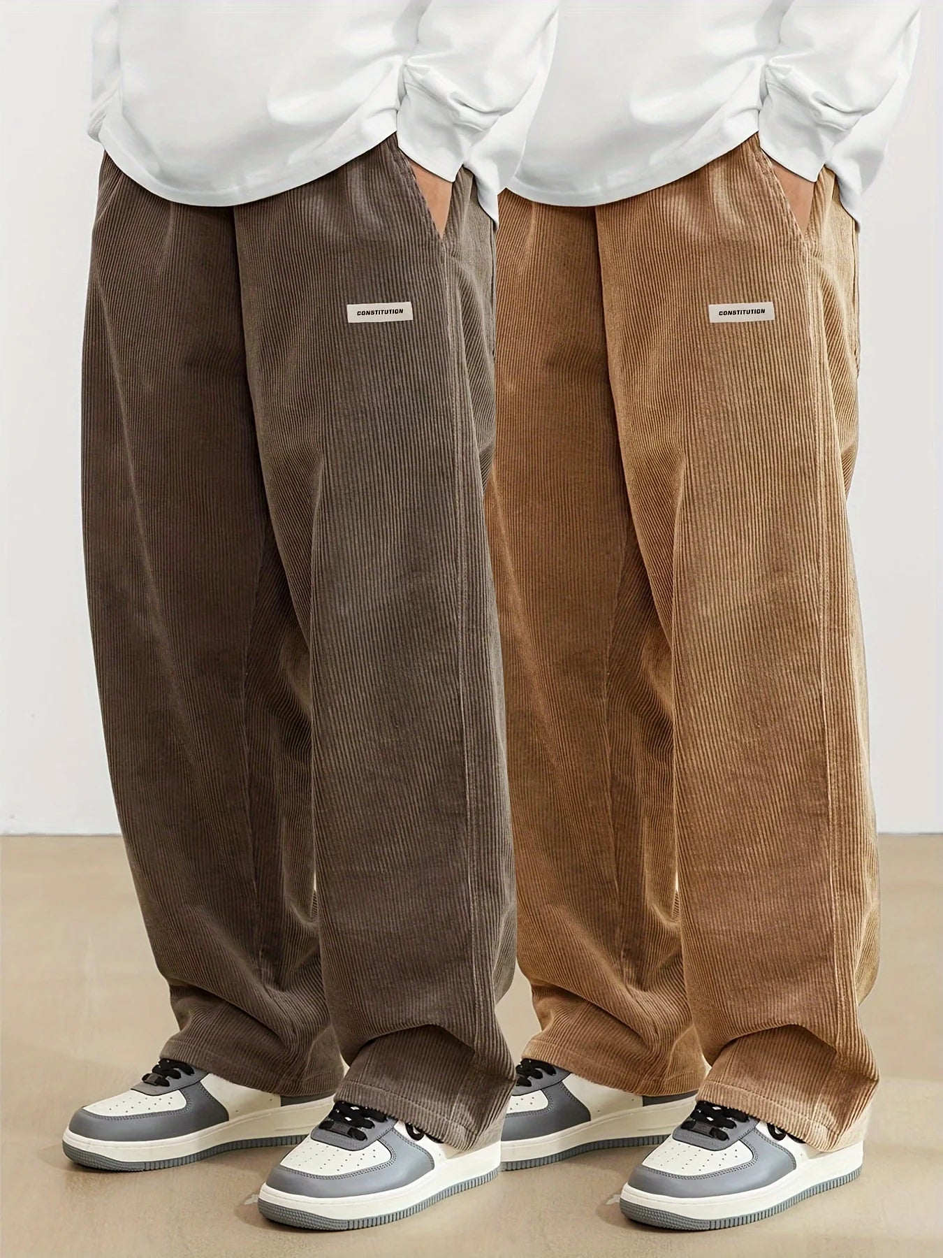 Two pairs of brown corduroy pants worn by models on a plain background