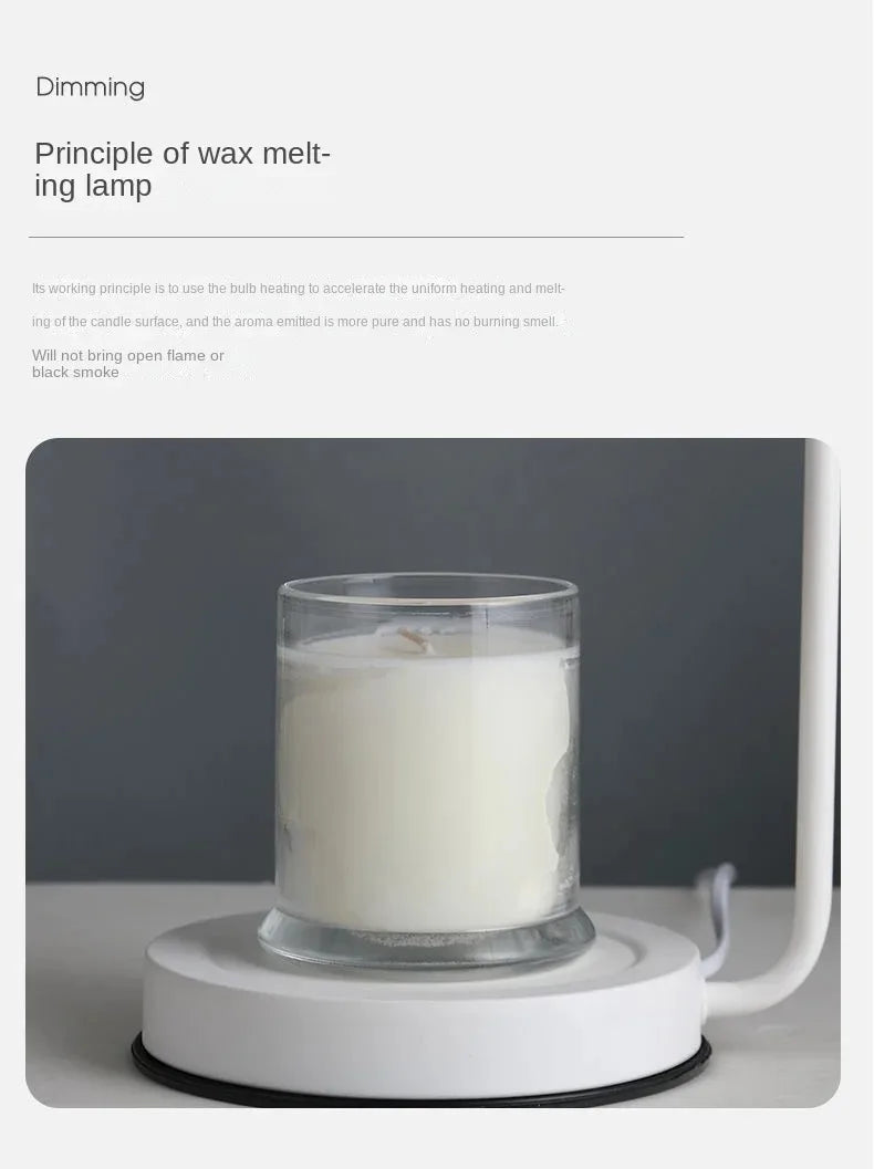 Candle in a glass holder on a white base with a gray background