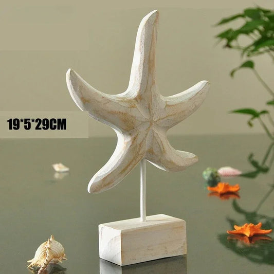 Decorative starfish sculpture on a stand with dimensions displayed, placed on a reflective surface.