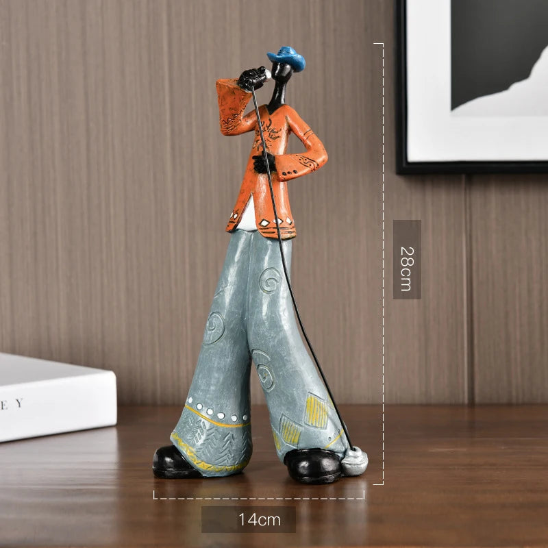 Decorative figurine of a person with a cane on a wooden surface, with measurements indicated.