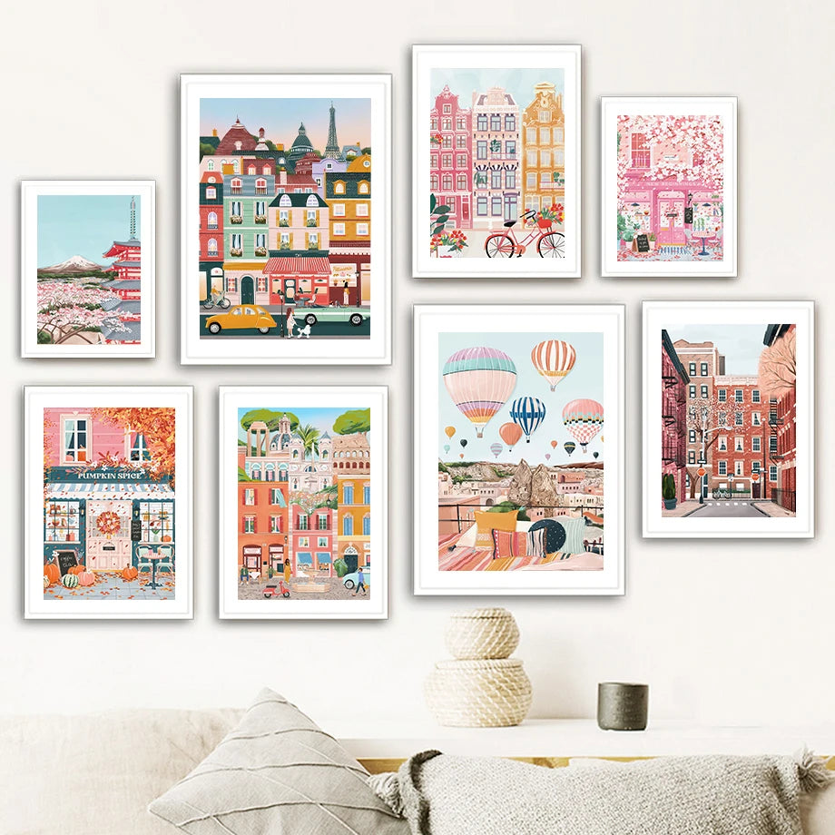 Set of colorful framed artworks on a wall above a sofa.