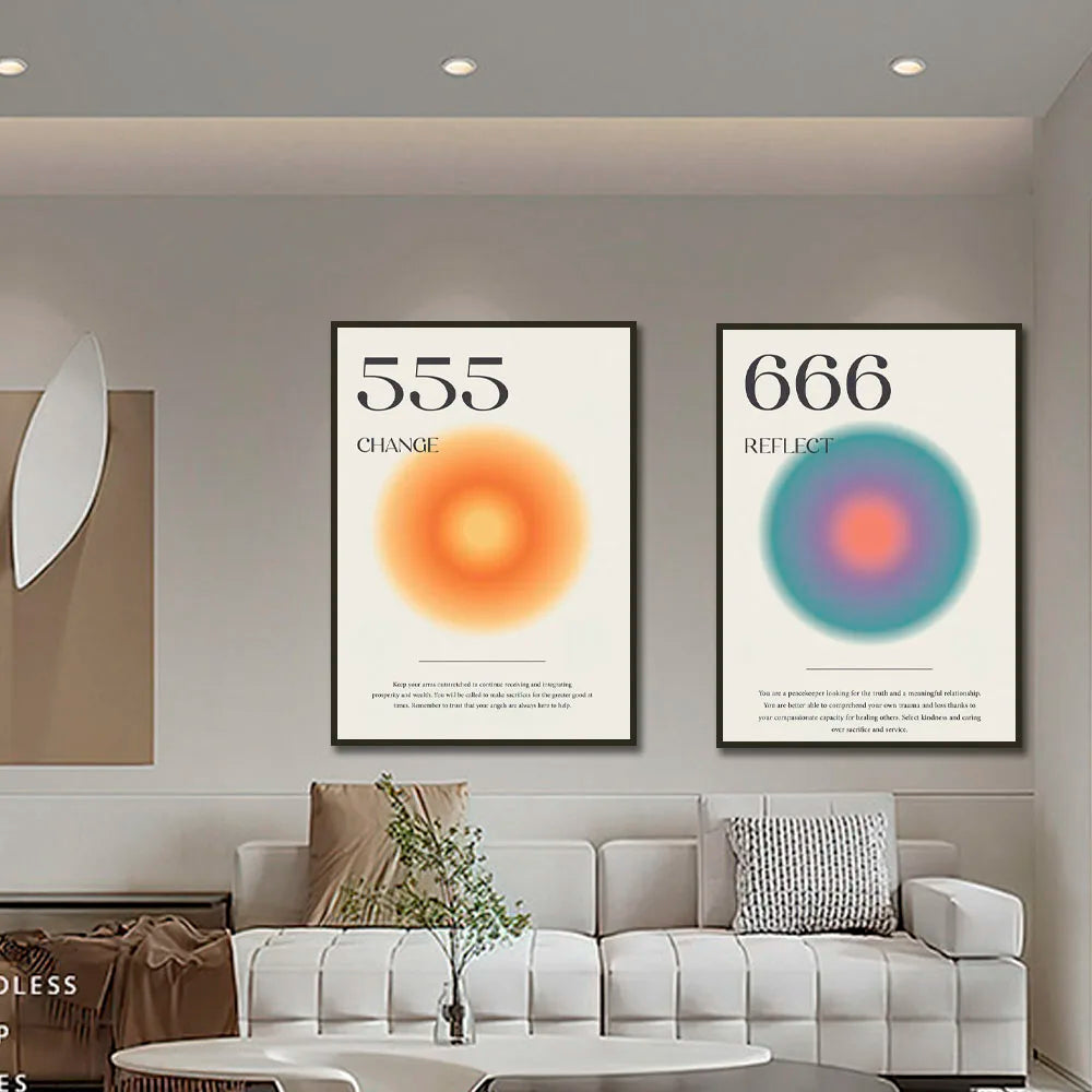 Modern living room with two framed posters on the wall above a sofa.