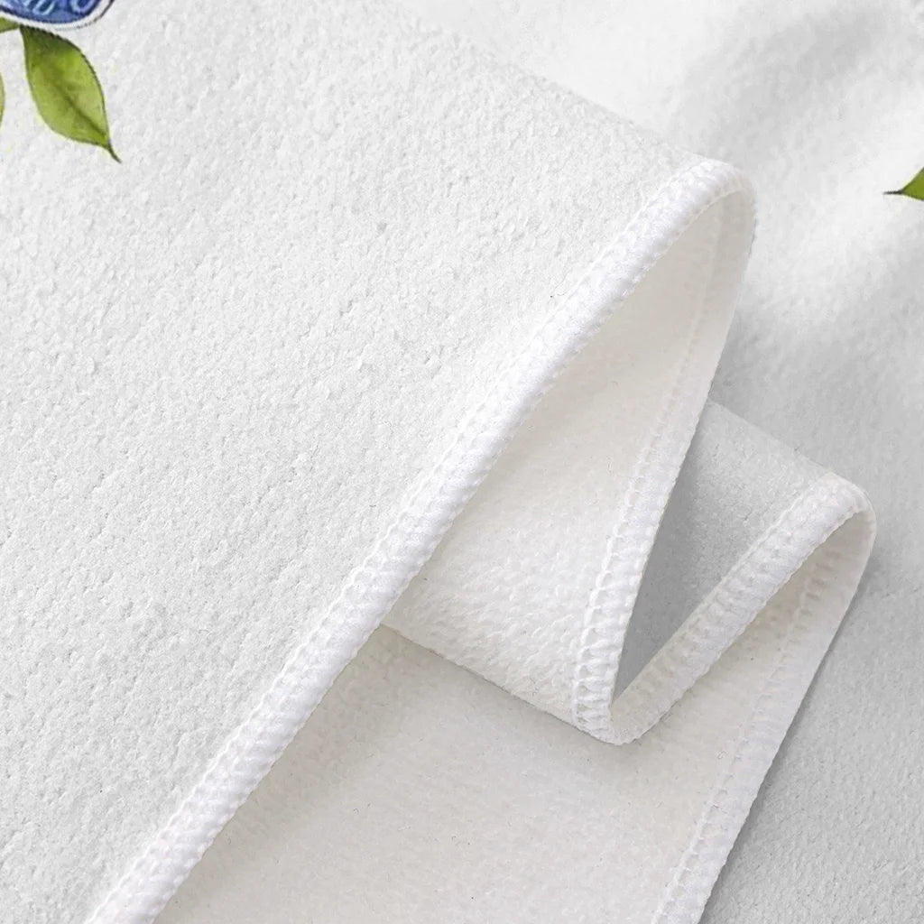 White textured fabric with a folded corner on a light gray background