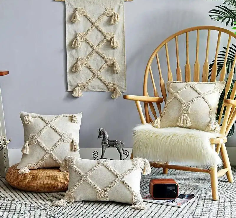 Cozy living room with a white sofa, wooden chair, and decorative pillows.