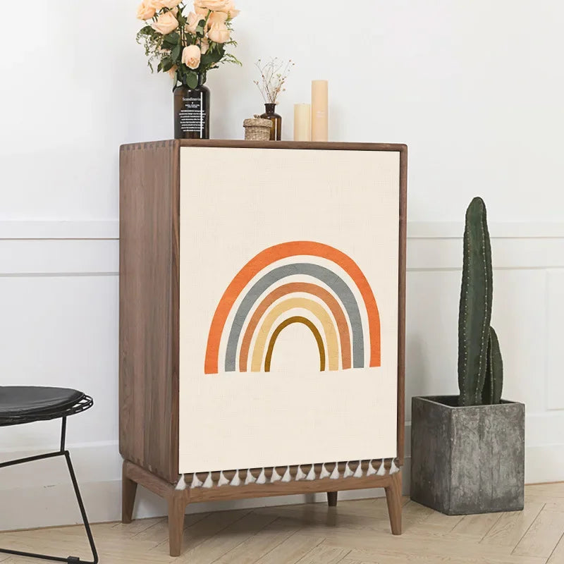 Multiple boho-style self-adhesive cabinet door curtains with abstract sun, moon, rainbow and geometric patterns on wooden cupboards