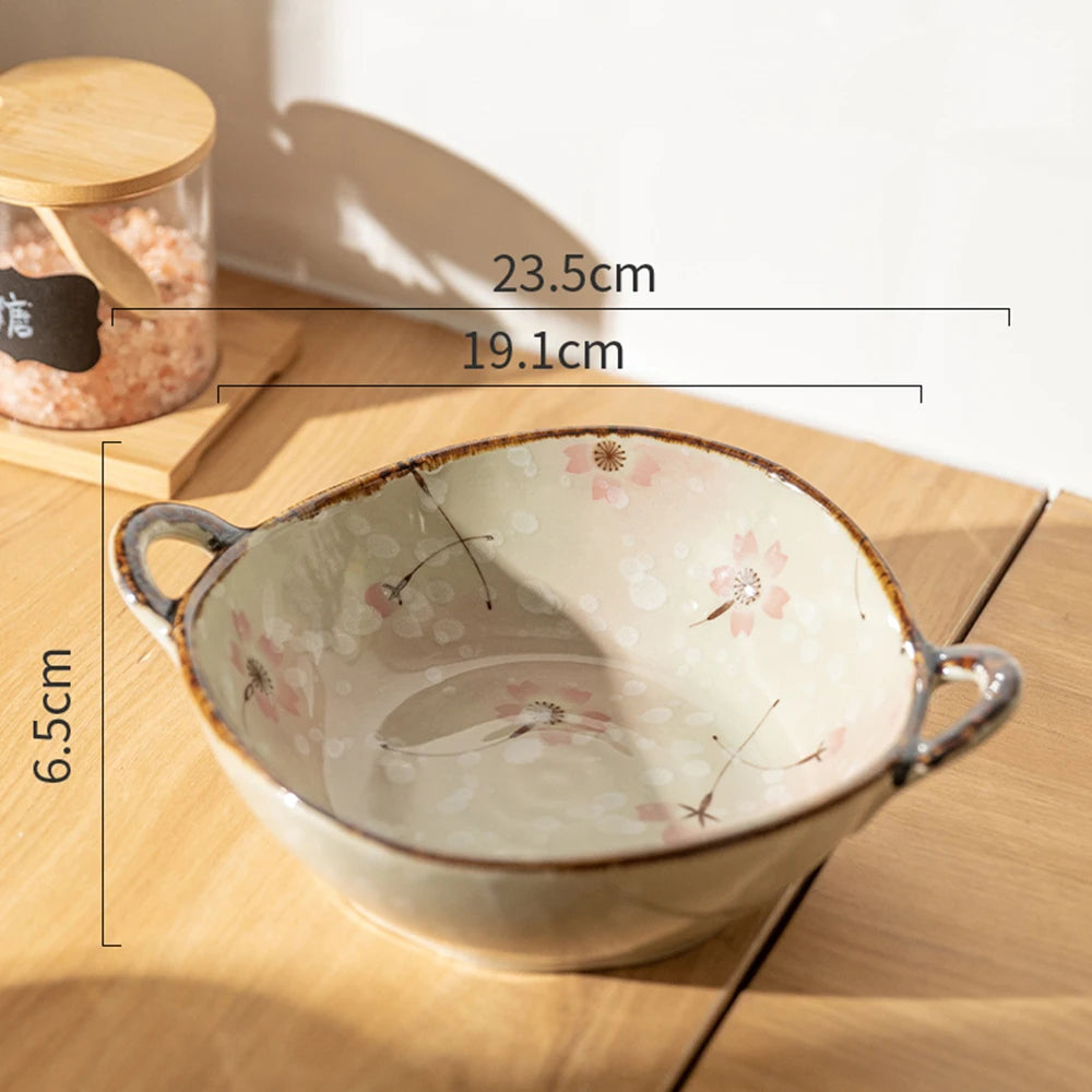 Ceramic bowl with floral patterns on a wooden surface, showing measurements.
