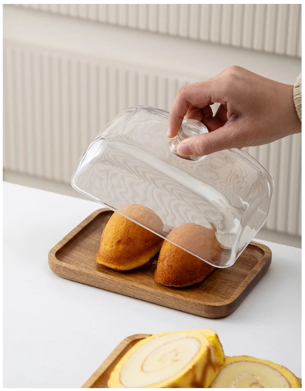 Glass pastry display dome with bamboo serving base